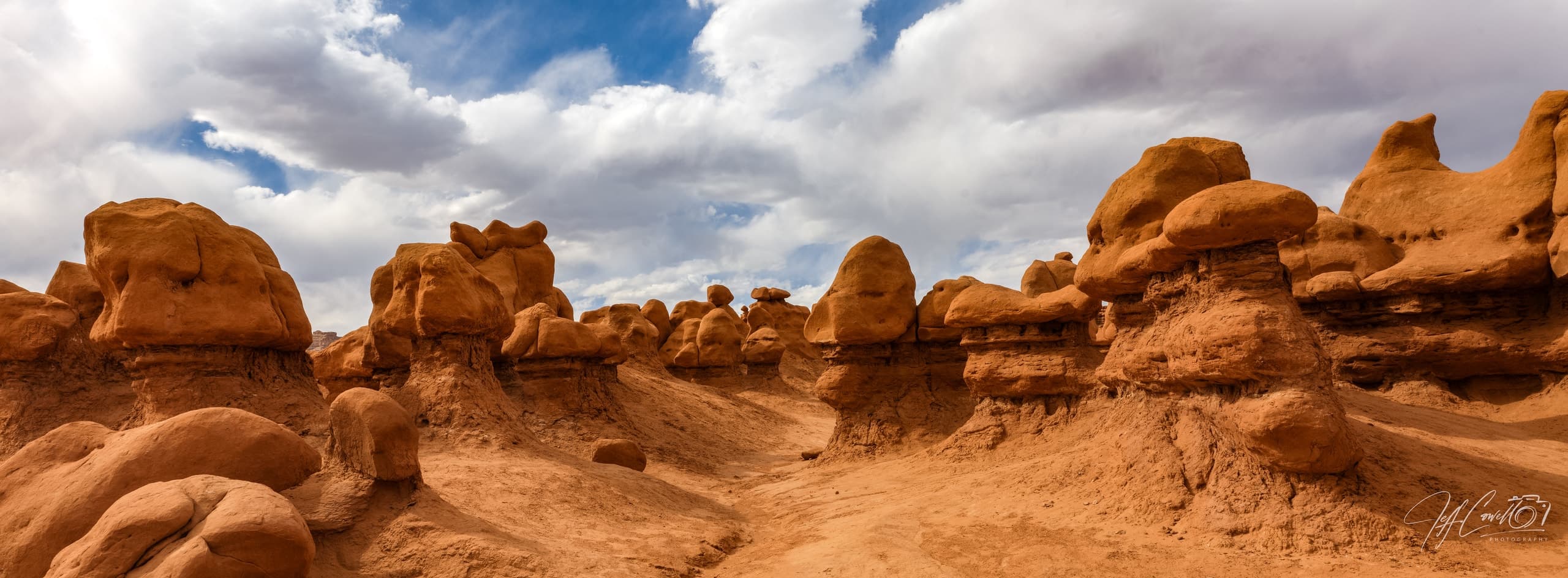 Hoodoos and open desert in Goblin Valley, Utah