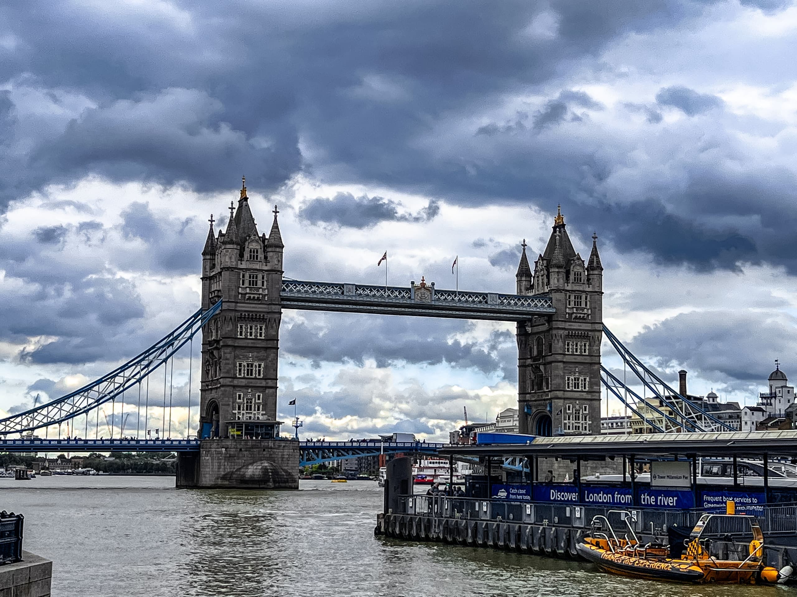 Tower Bridge over the Thames under a heavy sky