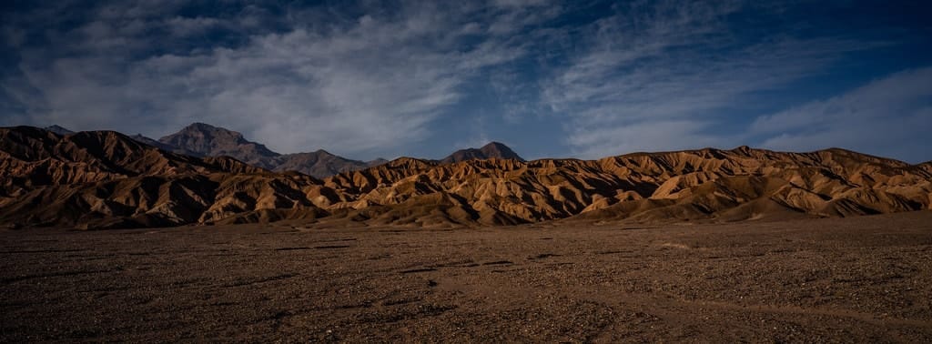 A desert range rising beyond the floor of Death Valley