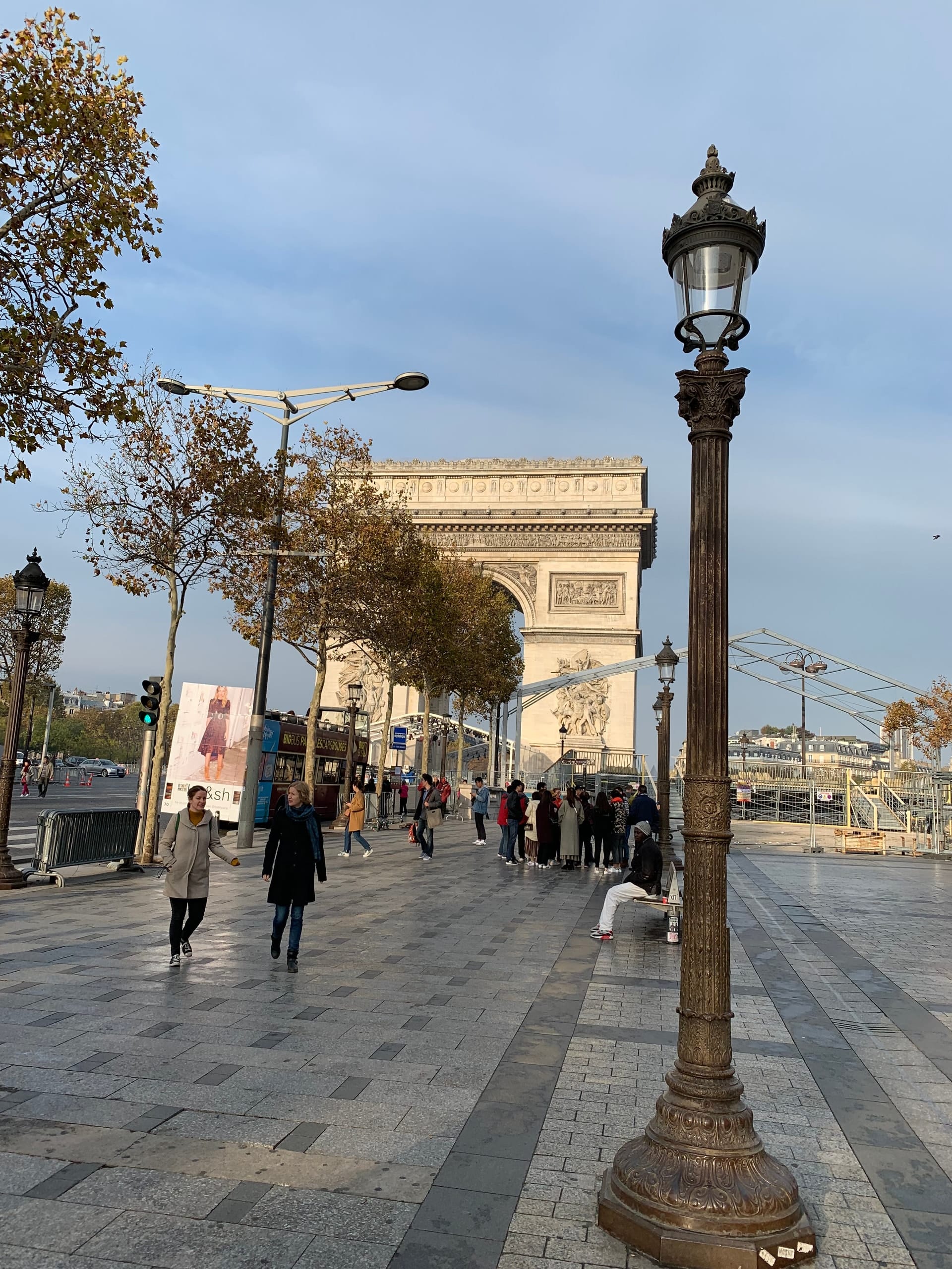 The Arc de Triomphe at the end of a Paris boulevard