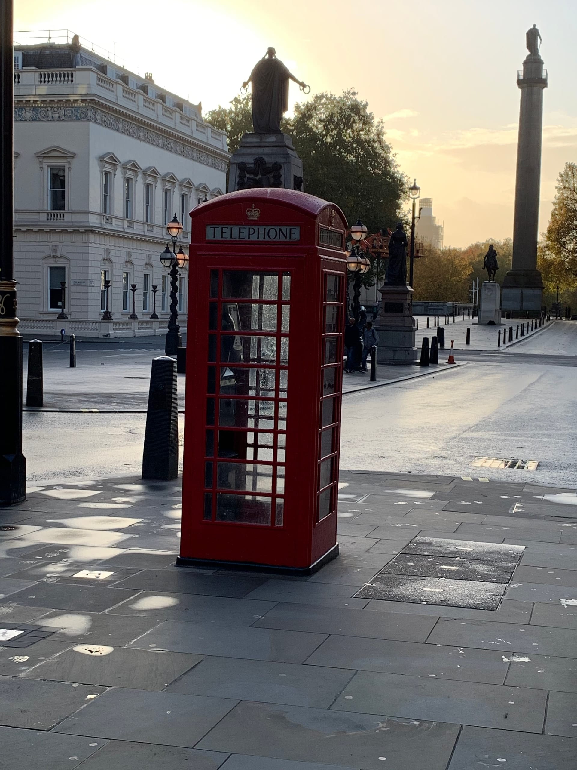 A red telephone box in late light